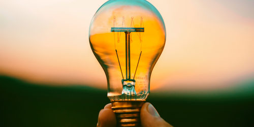 Ideas and strategies - hand holding lightbulb | Readable, free readability analyser