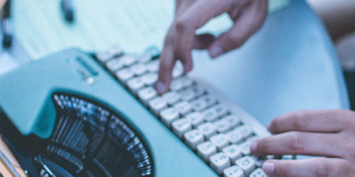 Hands typing on a typewriter | Readable, free readability test