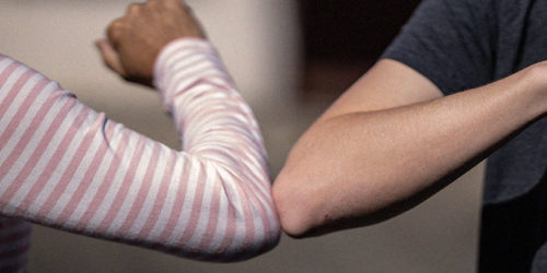 Two elbows bumping | Pandemic clichés blog | Readable, free readability test