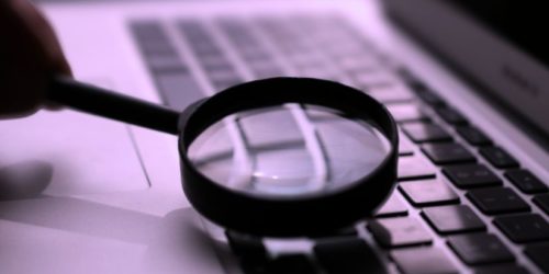 Image of magnifying glass to signify fact checking